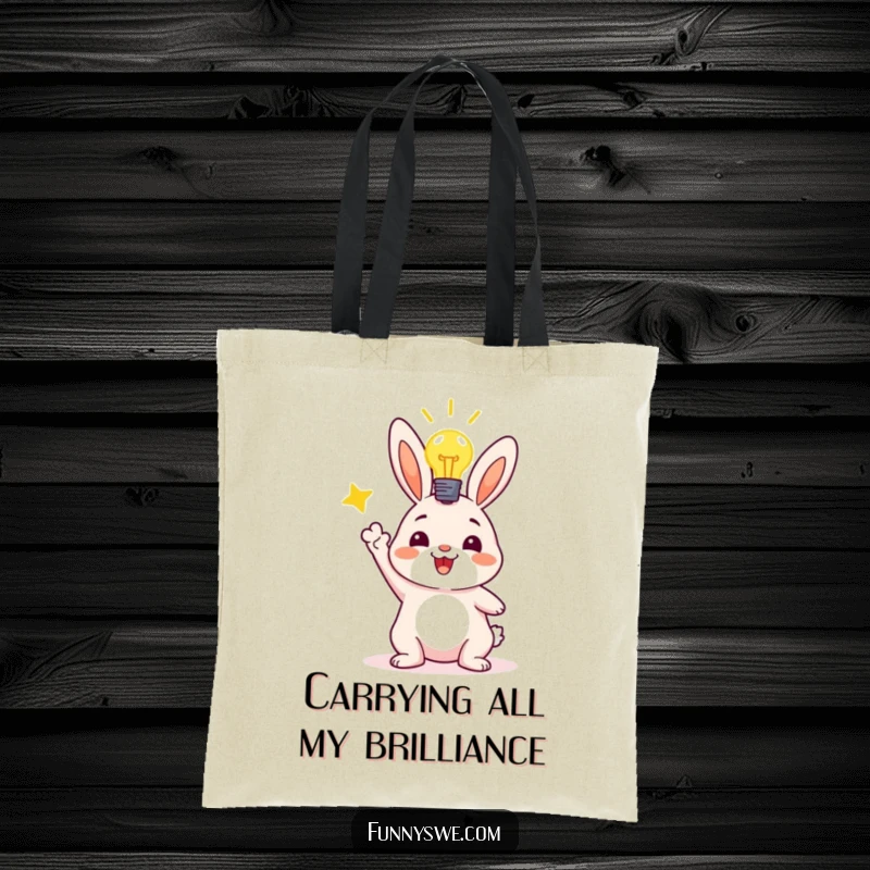 Funny tote bag with a joyful bunny character holding a laptop, celebrating a successful code deployment with a lightbulb overhead.